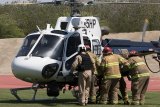 The California Highway Patrol helicopter prepares to take a victim to the Adventist Health, part of Lemoore High School's Every 15 Minutes program.